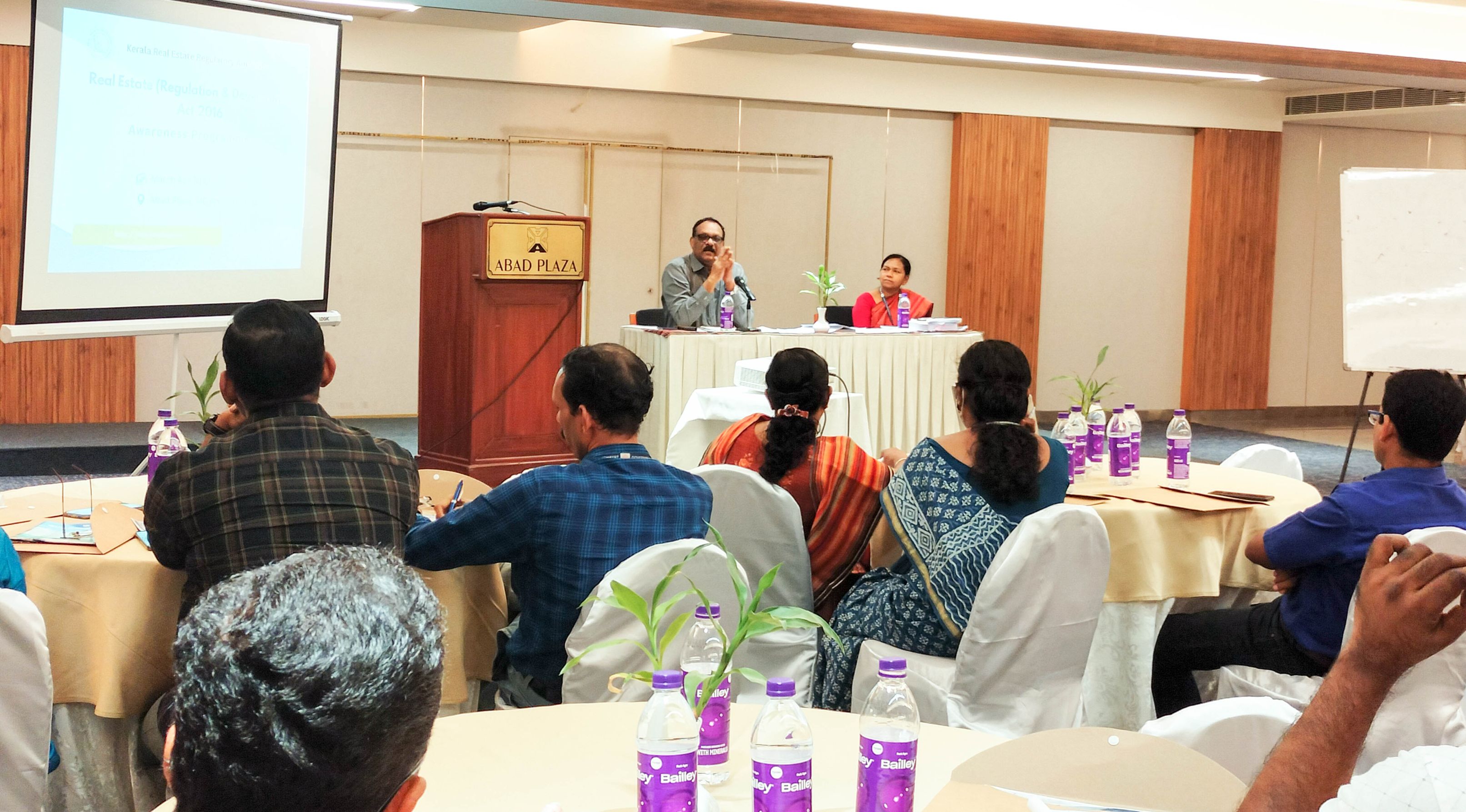 K-RERA Chairman P.H. Kurian and Secretary Sheeba Rani Y addressing the LSG officials from Cochin corp. and surrounding LSGs.